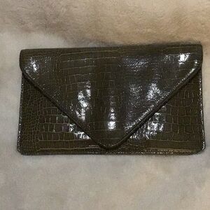 Gorgeous leather reptile print clutch.